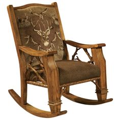 a wooden rocking chair with deer head on the back and armrests, in front of a white background