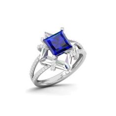 a white gold ring with a blue sapphire and diamonds