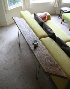 a couch with a wooden table on top of it