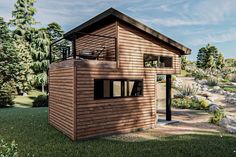 a small wooden house sitting on top of a lush green field