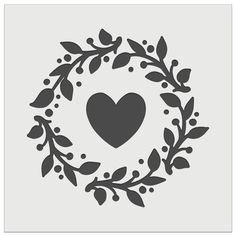 a wreath with a heart in the middle and leaves around it, on a white background