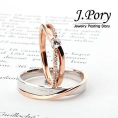 two wedding rings sitting on top of an open book with the title j pory jewelry posting story