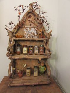 a wooden shelf with jars and spices on it