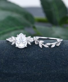 Pear shaped Moissanite engagement ring set vintage white gold ring Marquise cut Diamond Leaf Branch ring set wedding set Anniversary ring -----Ring Information----- Engagement ring +Center stone: 8*10mm Moissanite +Cut type: Pear shaped +Side Stone:  Natural Diamonds or Moissanite Approx weight: 0.3ctw Wedding band  +Stones: Diamonds or Moissanite Approx weight: 0.31ctw Metal : Solid 14k/18k yellow gold white gold or rose gold, other metal or gemstones, please contact me! Click on the "Pin It" icon if you like this item, Thanks so much! Ring Size All rings are standard CA/US size, 3-9US can be selected from the drop-down menu. If want other ring size, please contact me, and I can make it for you. Processing Time  Most of rings will take 2-3 weeks to make. I am  glad to accept any rush orde Engagement Rings White Gold, Silver Leaf Ring, Rings White Gold, Leaf Engagement Ring, Moissanite Engagement Ring Set, Branch Ring, Ring Marquise, Full Eternity Ring, Curved Wedding Band