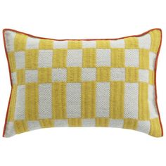 a yellow and white checkered pillow on a white background