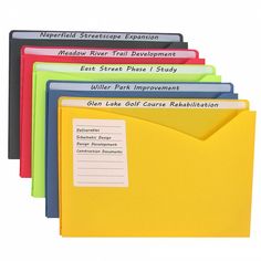 several colored folders with labels on them