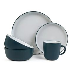 a set of dishes with cups and saucers on the side, including one for two