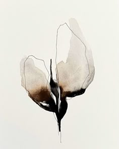 a white and black flower is shown against a gray background with watercolors on it