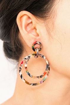 Ethical jewelry: Margot Multicolored Resin Dangle Earrings, a staff favorite! Playful and lightweight, crafted from multicolored resin with stainless steel posts. Hypoallergenic. Size: 2.5 inches. Box size and color may vary. Supports ethical initiatives. Multicolored Earrings, A Staff, Colorful Earrings, Women Helping Women