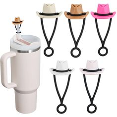 four different colored hats are attached to the handle of a coffee cup and mug holder