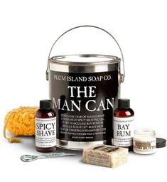 the man can is next to some soaps and other things in front of it