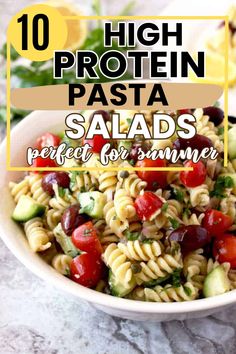 pasta salad with tomatoes, cucumbers and olives in a white bowl on a marble surface