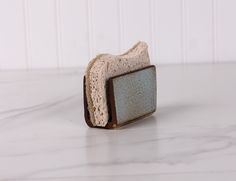 a piece of bread sitting on top of a white counter