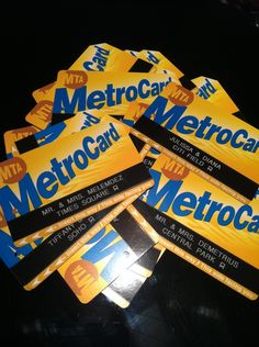 five metrocards are stacked on top of each other in the middle of a pile