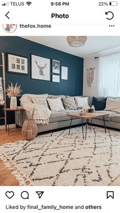 a living room with blue walls and white rugs on the floor is featured in this instagram