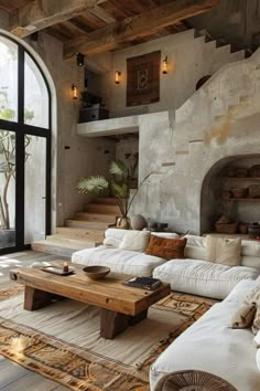 a living room filled with lots of white furniture