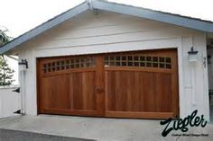 an image of a garage with two wooden doors