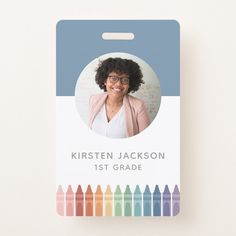 an id card with a photo of a woman in glasses and colored crayons