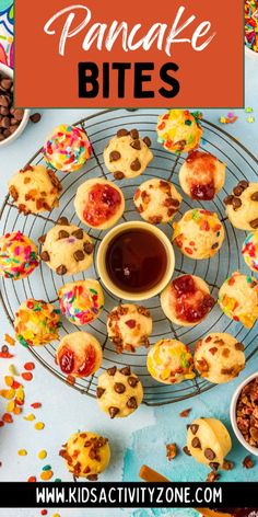 a pancake bites on a cooling rack with chocolate and sprinkles around it