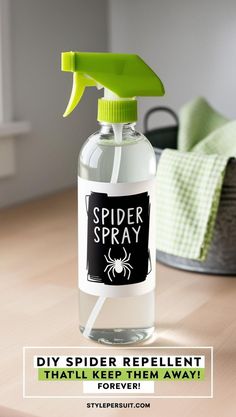 a spider spray bottle sitting on top of a wooden table