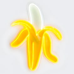 a banana shaped sticker sitting on top of a white surface