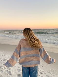 The Poppy Blush and Blue Striped Oversized Sweater is the coziest and cutest sweater for your day-to-day outfits! Blush and blue striped fabric shape this oversized sweater with a round neck, a tunic length, and bubble sleeves. Features ribbed accents at the hem. Style your favorite baggy jeans for a casual look. DETAILS & CARE 55% Cotton/30% Acrylic/15% Nylon Hand wash cold. Imported. Beachy Sweater Outfit, Beachy Aesthetic Clothes, Beachy Sweaters, Cold Summer Days Outfits, Cold Summer Day Outfit, Beachy Winter Outfits, Beachy Outfits Aesthetic, Beachy Fits, Beach Sweaters