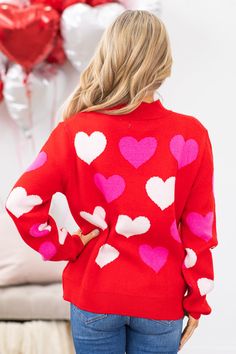 Product Details Colors: Red, Pink, White Print: Hearts Neckline: Mock Neck Sleeve: Long Sleeves Hemline: Straight Brand: Miracle Material and Care 53% Viscose 26% Polyester 21% Nylon Hand Wash Cold Hang/Line Dry Size and Fit Small/Medium: Bust 42" Waist 40" Length 24.5" Medium/Large: Bust 44" Waist 42" Length 24.5" Photo model is 5'4 and wearing a size small/medium Red Heart Pattern, Intarsia Sweater, Red Heart Patterns, White Hearts, Heart Sweater, Kandy, Athleisure Wear, Halloween Fashion, Heart Pattern