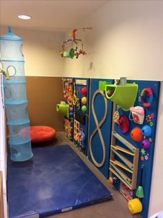 a child's play room with toys and accessories