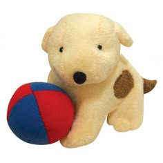 a stuffed dog with a ball in it's mouth