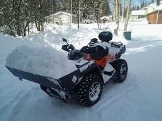 a snowmobile is parked in the snow