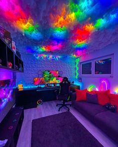 a living room filled with lots of furniture and colorful lights on the ceiling above it