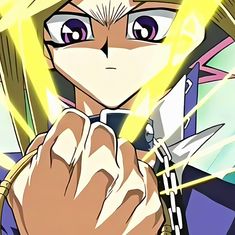 an anime character holding a cell phone in his right hand and looking at the camera