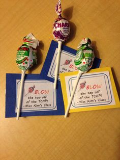 two lollipops are sitting next to each other on top of a table