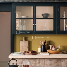 a kitchen counter with dishes and utensils on it