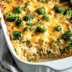 a casserole dish with broccoli and chicken in it