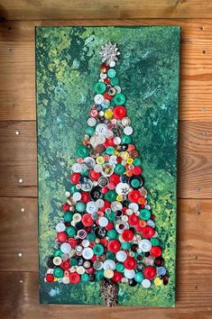 a bottle cap christmas tree is displayed on the wall