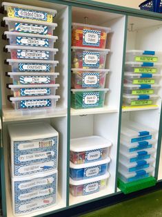 the shelves are filled with plastic containers and bins for school lunches, books, and more