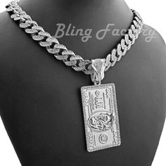 $100 Dollar Bill Benjamin & 12mm 16" ~ 24" Iced Cuban Box Lock Chain Necklace HIP HOP CELEBRITY STYLE BRAND NEW USA SELLER Product Description Iced Cuban Chain : Chain Length : 16" 18" 20" 24" Chain Width : 12mm White Gold Plated over alloy Cubic Zirconia Stones Box Lock Pendant : Hip Hop Celebrity Style Pendant & Chain WHITE GOLD PLATED OVER ALLOY SIZE OF PENDANT : 55mm x 30mm High Quality and polished. Payments: US Customers: Paypal accepted International Customers: Paypal accepted Shipping: For Shipping & Handling within the US: FREE We do combine shipping! We ship via USPS (Post office) First Class Mail Tracking Info will automatically be posted via Paypal and ebay. Approximate Delivery Times: US: 2-5 BUSINESS DAYS Canada: 1-2 weeks Europe: 1-6 weeks South America: 2 weeks Australia: 2 Lock Chain Necklace, 100 Dollar Bill, Cuban Chain Necklace, 100 Dollar, Dollar Bill, Cuban Chain, Fashion Jewelry Necklaces, Chain Lengths, Fashion Watches