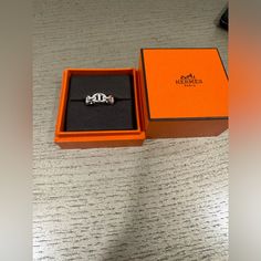 Gently Used Authentic Hermes Silver Ring. Comes With Original Box. Luxury Silver Jewelry With Original Box, Designer Silver Jewelry With Original Box, Designer Silver Jewelry In Original Box, Designer White Gold Rings For Gift, Luxury Jewelry With Box For Anniversary, Luxury Jewelry For Anniversary With Box Included, Designer Platinum Jewelry Gift, Designer Platinum Jewelry For Gift, Timeless Jewelry In Original Box For Gift