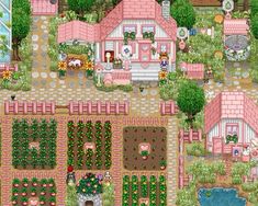 an aerial view of a pink house and garden