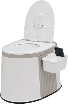 a white toilet sitting on top of a counter next to a trash can and cell phone