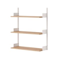 two white shelves with wooden shelves on each side and one shelf has three square brackets attached to it