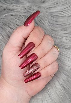 Please read full description These nails are the most beautiful shade of wine red I've ever seen. The ring finger is accented with a gold glitter that goes great over the red. They are shown in a long length, coffin shape, but can be made in multiple shapes, sizes, and lengths.  I offer hand-painted press-on nails made with mostly gel polish. Gel polish will give you longer lasting nails with no chipping. All of my sets are handpainted by me. I do not order wholesale or mass produced nails to re Gold And Red Nails Acrylic, Wine Colored Nails, December Nails Red, Red Sparkle Nails, Press On Nails Red, Red Press On Nails, Nails Luxury, Long Stiletto Nails, Orange Stick