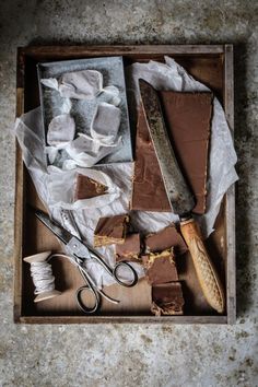 a tray filled with lots of different types of chocolates and other things on top of it