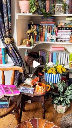 a living room filled with lots of books and furniture