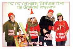 a group of people standing next to each other in front of a christmas card with the words happy holidays written on it