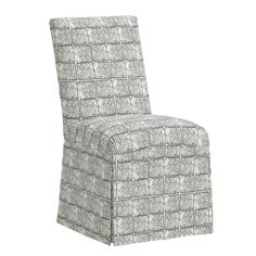 a gray and white patterned chair on a white background