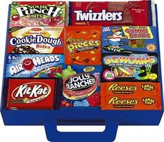 a blue lunch box filled with lots of different flavored candy bars on top of each other