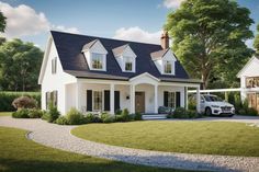 a white house with a black roof and two cars parked in front of it on the grass