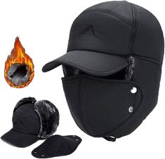 a black helmet with flames on the side and other items around it, including a hat